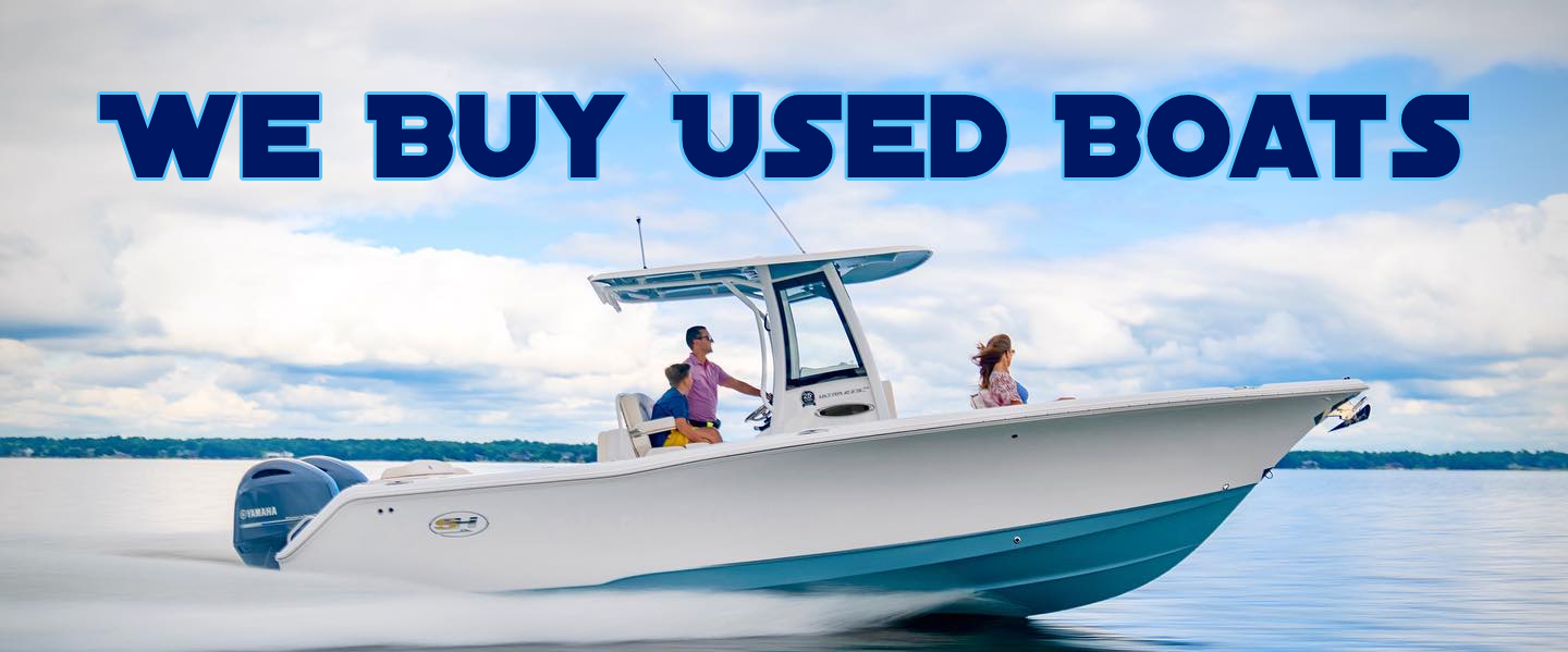 A family of three riding a white boat with Yamaha Marine outboards, with the text "We Buy Used Boats" above them.